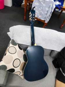 Guitar in good condition, with capo