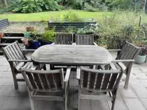Free to a good home - solid outdoor table and six chairs