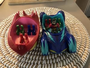 Two plastic robin cars with Robin figure in one