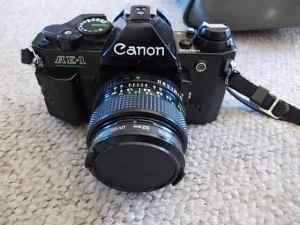 CANNON AE1 PROGRAM CAMERA IN WORKING COND WITH 2 EXTRA LENSES