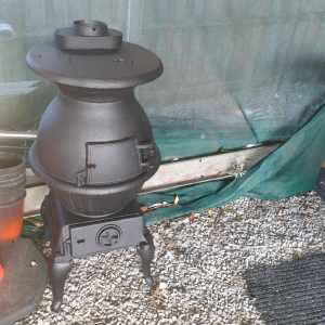 Old cast iron potbelly stove wood heater in good condition 