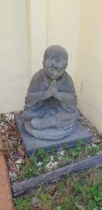 Buddha statue on concrete slab