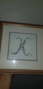 Framed embroidered "K"