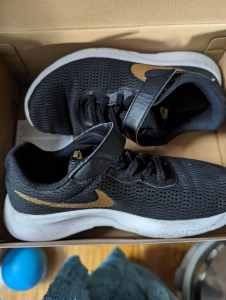 Kids Nike shoe black and gold