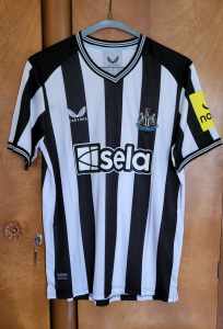 Newcastle United FC jersey.