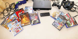 Playstation 2 Console, Controller, Steering Wheel, Gun & 11 games