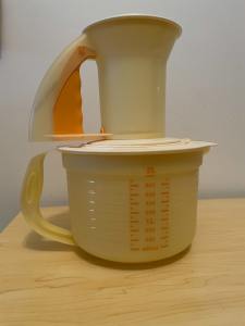 Tupperware yellow mixing bowl and sifter set