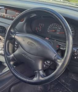 FORD AU-NU GHIA LEATHER STITCHED STEERING WHEEL.