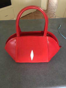 Vibrant Red coloured with long strap handbag