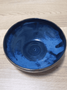 Signed MARY ELLIOTT blue pottery bowl in good condition 17cm diameter