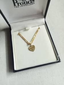 Gold chain for sale, has pendant daughter