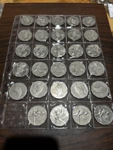 50c coin collection in plastic sheet