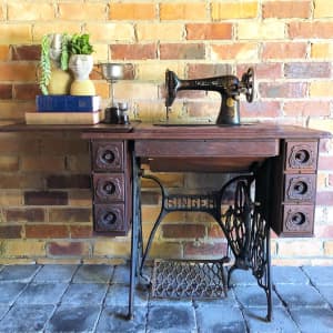 Antique Singer cast iron treadle sewing machine table.