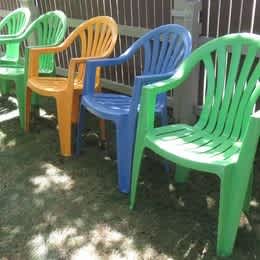Five colured outdoor plastic chairs