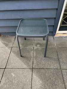 Outdoor metal and glass side table