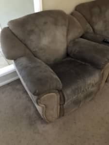 Two suede brown recliners