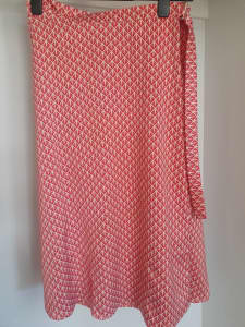 Wrap-around red patterned midi skirt in size 12