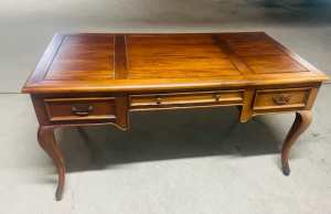 Solid wood desk with three drawers. 