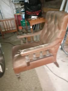 Antique stuffed leather armchair