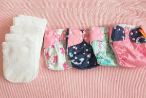 4 Cloth Nappies plus 5 inserts