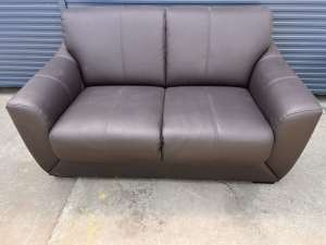 Two seater lounge in a brown leather look material $25