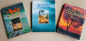 Three large hardcover cookbooks of Australian and Asian recipes