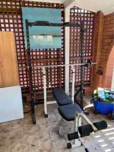 Squat rack w/pull up handles & Bench with leg extension.