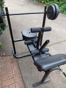 GYM EQUIPMENT-BENCH WITH LONG BAR AND 50KGS OF WEIGHTS