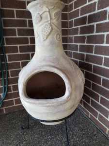 Chiminea - clay on stand. Hardly used been kept under cover.