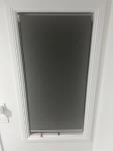 Used roller blinds in dark grey