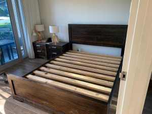 Queen sized bed with bedside tables