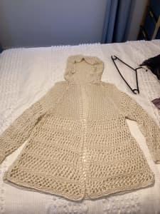 Hand knitted long hooded jacket. 80% Linen 20% Nylon.