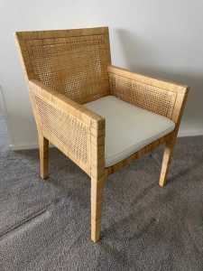 Brand new still in the carton 5 cane chairs with cushions.