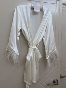 White robe with feathers