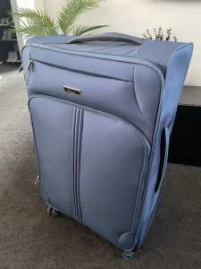 itLuggage 80cm blue soft case suitcase - 4 spare pink wheels