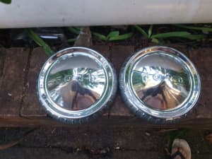 Two early Ford chrome hubcaps 
