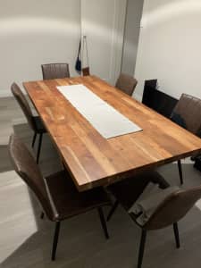 Solid wooden dining table with chairs