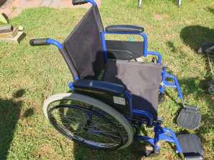 Wellness plus Folding wheel chair with lift up arm rests and hinged fe