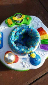 Exersaucer with turntable, disco ball, microphone, songbook, keyboard