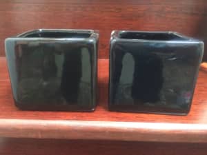 Two small black ceramic square storage containers