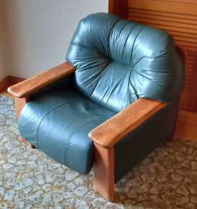Lounge Chair - Old and Comfy Padded Green Leather.