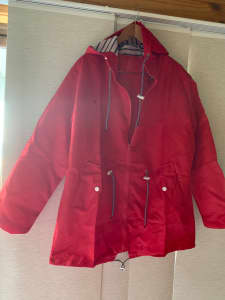Red anorak jacket with hood/striped lining