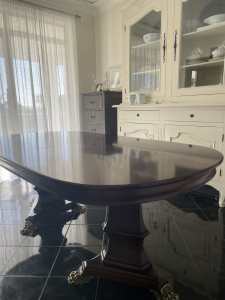 Antique solid brown wooden dinner table