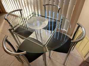 Glass round dinning table with 4 chairs