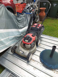 Mower with catcher and mulch block.