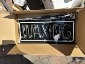 Waxing sign (electric)