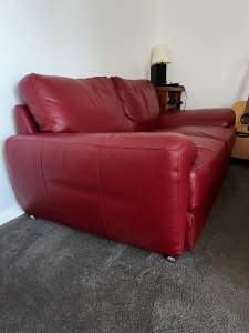 2 seater red leather lounge