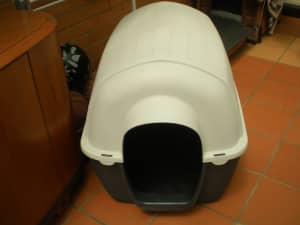 DOG KENNEL MED/LRG PLASTIC...comes apart for transporting & cleaning.