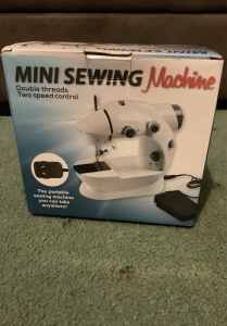 Portable mini sewing machine