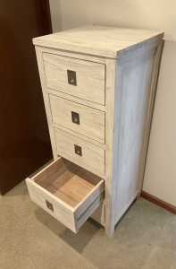 Chest of drawers and bedside table.
